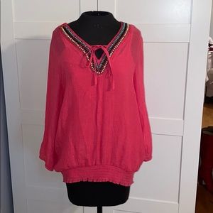 Pink long sleeve with beads around the neck